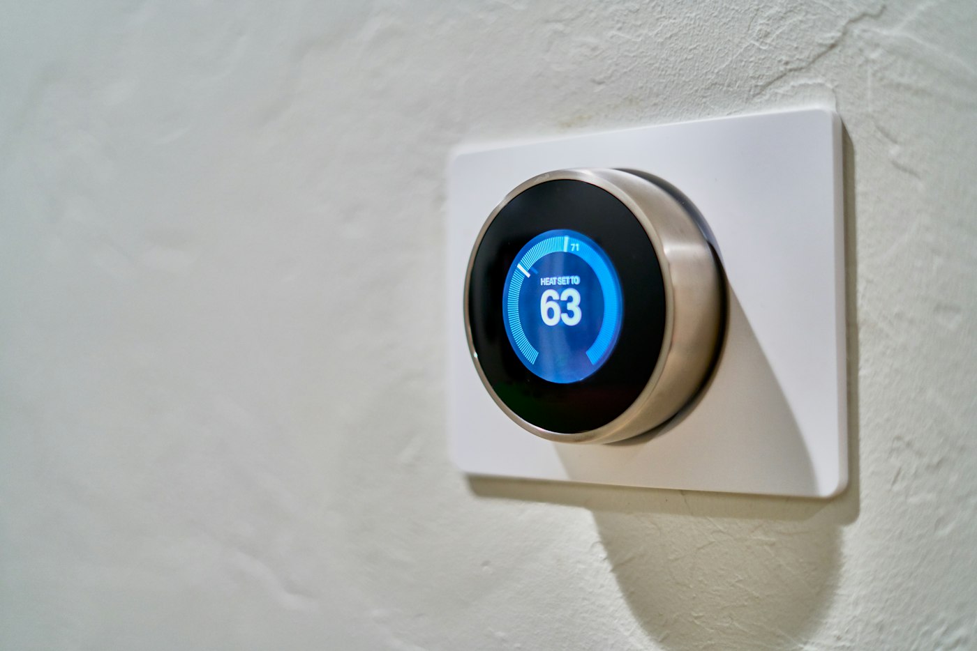 Smart thermostat on a living room wall